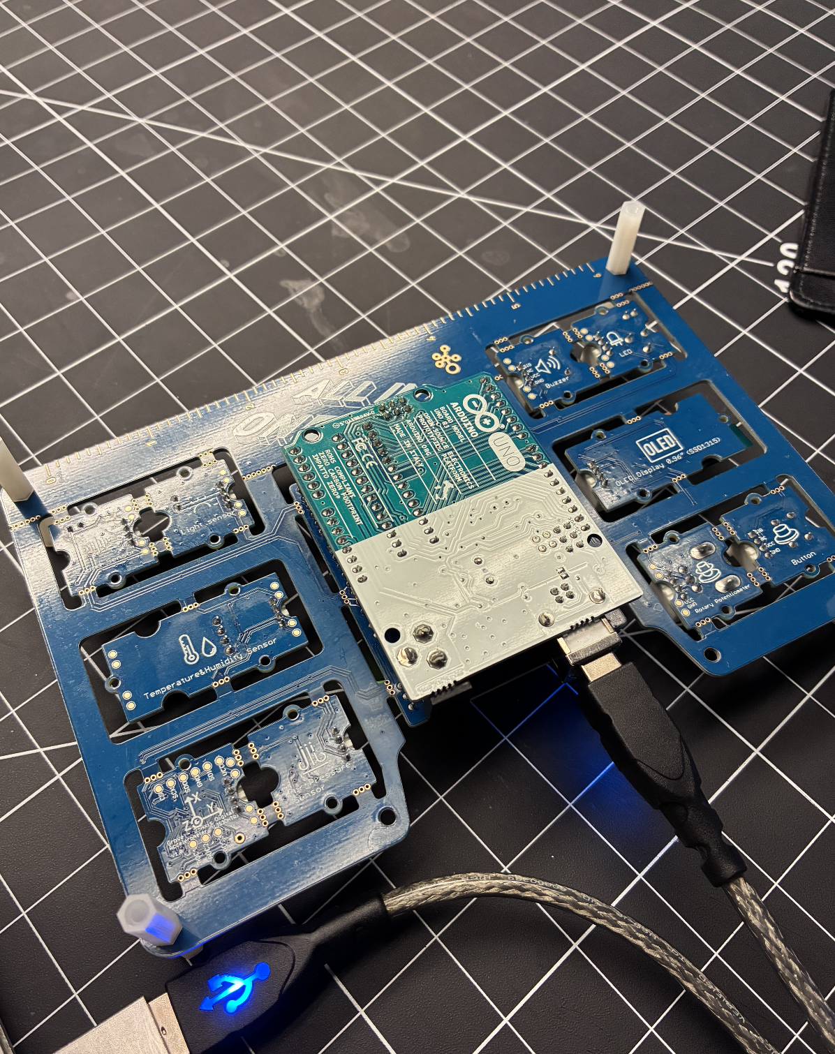 Back of an Arduino UNO, all-in-one board, with multiple sensor modules such as temperature, humidity, potentiometer to help us interact with TouchDesigner.